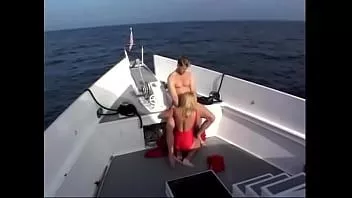 play Sexy blonde in a red swimsuit sucks a tight cock of an excited stud with pleasure and gets a mouthful of cum
